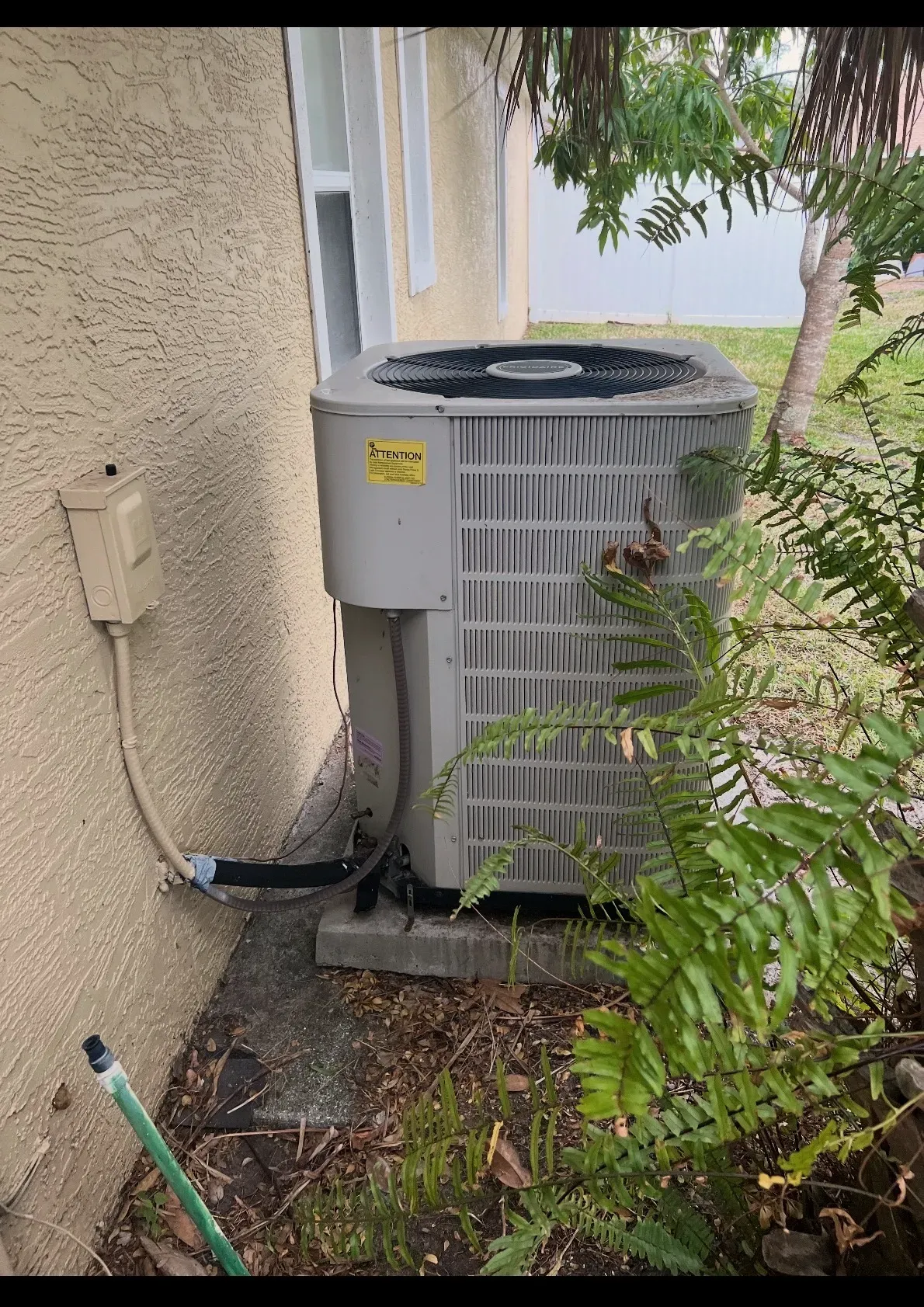 A Legacy-installed residential air-conditioning condenser