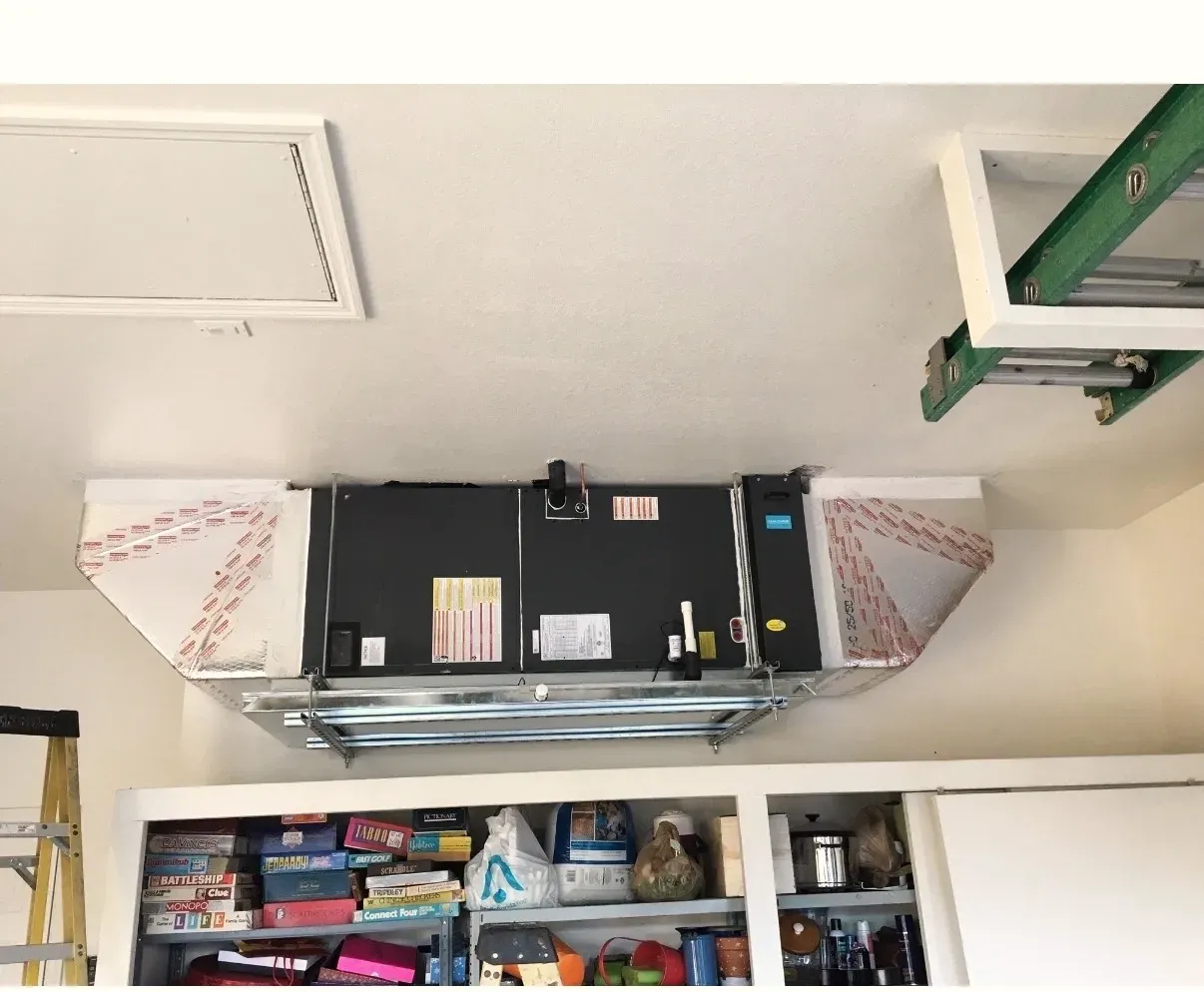 A residential ceiling-mounted air handler installed by Legacy