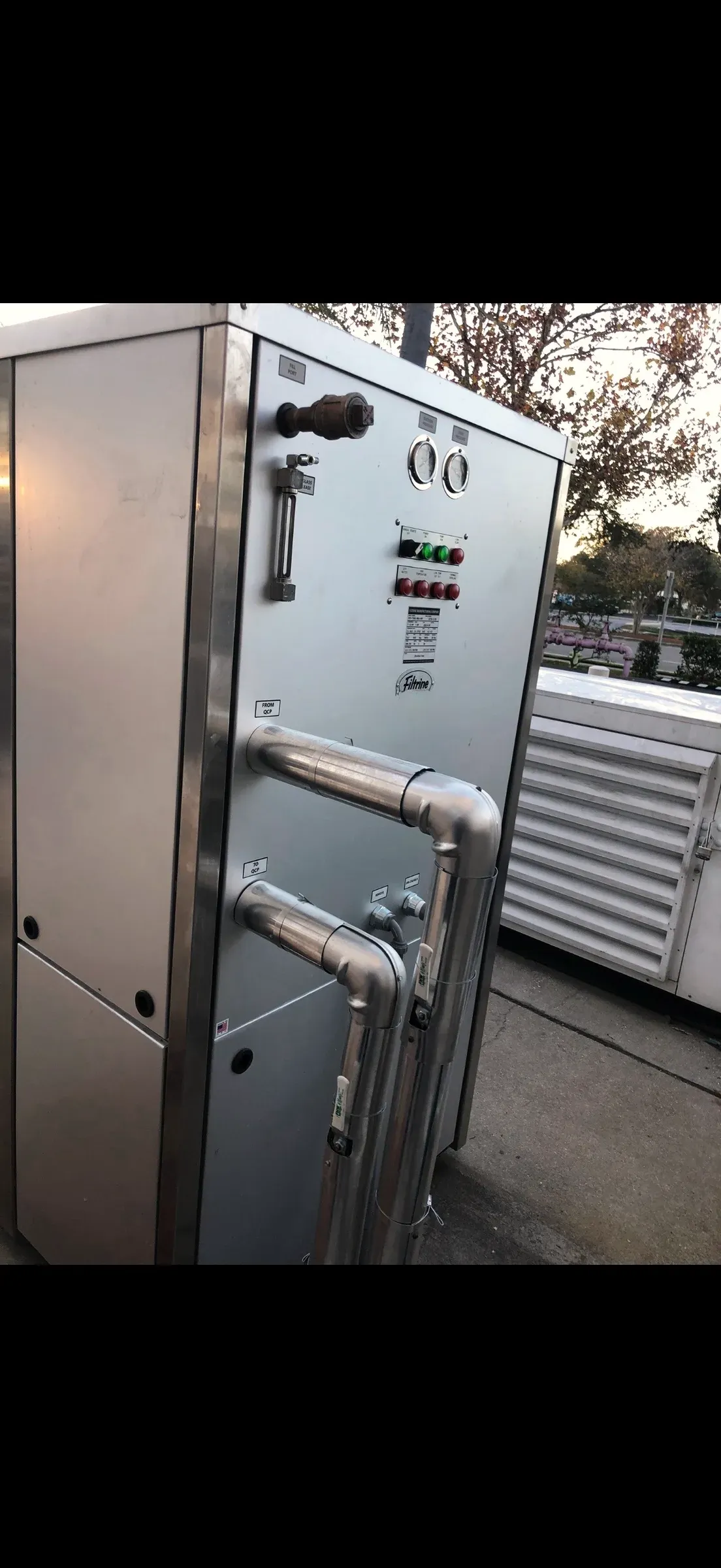 A commercial mechanical room serviced by Legacy — gauges, valves, and refrigerant lines