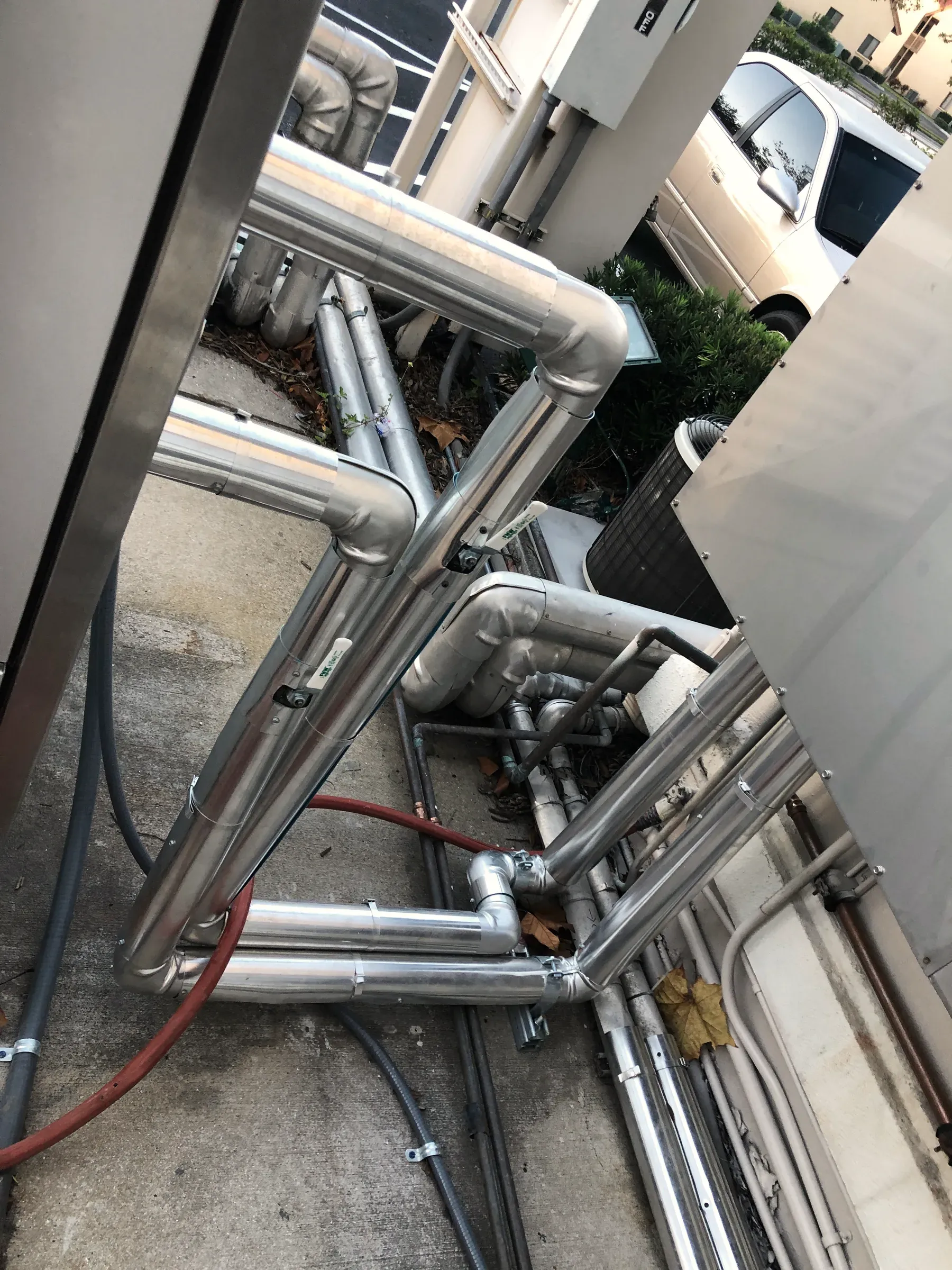 Insulated stainless mechanical piping on a commercial system installed by Legacy